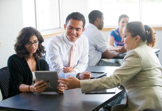 Some People Working at a Conference Table