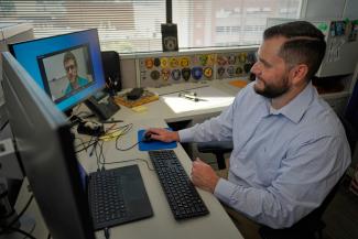 A Person working on a Lap Top computer