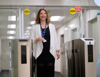 A woman walking into an office